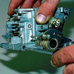 The process of removing the carburetor from the field